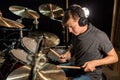 Male musician playing drums and cymbals at concert