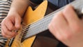Male musician playing five string guitar, close up. Slow motion Royalty Free Stock Photo