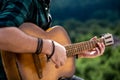 Male musician playing guitar, music instrument. Man`s hands playing acoustic guitar, close up. Acoustic guitars playing Royalty Free Stock Photo