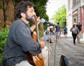 Male musician playing in the street of Seville, Spain.