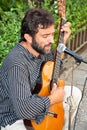 Male musician playing in the street of Seville, Spain.