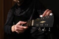 Male musician tuning the strings on the guitar Royalty Free Stock Photo