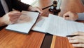 Male Notary lawyer or judge consult or discussing contract papers with Businessman client in office, Law and Legal services