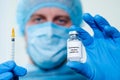 Male Nurs holding vaccine bottle with Coronavirus vaccine