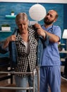 Male nurse assisting elderly female patient Royalty Free Stock Photo