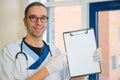 Male nurse with blotting pad