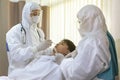 Male nurse and doctor wearing ppe suit and facemask perform Coronavirus COVID-19 PCR test. patient nasal NP and oral OP swab Royalty Free Stock Photo