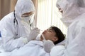 Male nurse and doctor wearing ppe suit and facemask perform Coronavirus COVID-19 PCR test. patient nasal NP and oral OP swab Royalty Free Stock Photo