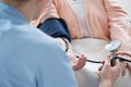 Male nurse measuring blood pressure Royalty Free Stock Photo