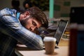 Male Office Worker Asleep At Desk Working Late On Laptop Royalty Free Stock Photo