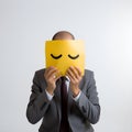 male office worker covering face with sad emoji white background, ai generative