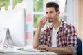 Male office worker front computer Royalty Free Stock Photo