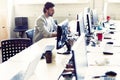 Male office worker looking at computer screen with data Royalty Free Stock Photo