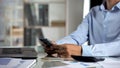 Male office worker typing on phone, appointing meeting with client, occupation Royalty Free Stock Photo