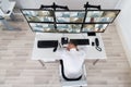 Male Operator Sleeping While Leaning On Security Monitor`s Desk Royalty Free Stock Photo