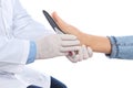 Male orthopedist fitting insole on patient`s foot against white background Royalty Free Stock Photo