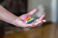 Male painter artist hand holding different color pastel crayons Royalty Free Stock Photo