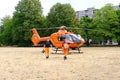 male paramedics go to modern Red medical helicopter, emergency aircraft Germany on helipad, Air medical services, Rapid Response