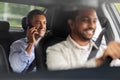 male passenger calling on smartphone in taxi car