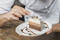 male pastry chef decorating dessert kitchen. High quality photo Royalty Free Stock Photo