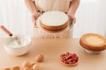 Male pastry chef holding sponge cake. The concept of homemade pastry, cooking cakes