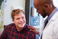 Male Patient Being Reassured By Doctor In Hospital Room Royalty Free Stock Photo