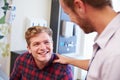 Male Patient Being Reassured By Doctor In Hospital Room Royalty Free Stock Photo