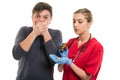 Male patient covering mouth for taking female doctor pills Royalty Free Stock Photo