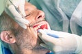 Male patient during dental hygiene at dentist office