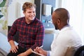 Male Patient And Doctor Have Consultation In Hospital Room Royalty Free Stock Photo