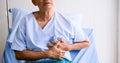 Senior patient hasing chest pain on sickbed at hospital room