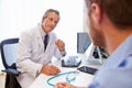 Male Patient Having Consultation With Doctor In Office Royalty Free Stock Photo