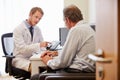 Male Patient Having Consultation With Doctor In Office Royalty Free Stock Photo