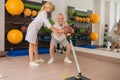 Male patient having a workout with a ball in rehabilitation center with a female instructor Royalty Free Stock Photo