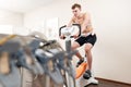 A male patient, pedaling on a bicycle ergometer stress test system for the function of his heart checked. Athlete does a Royalty Free Stock Photo