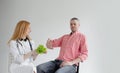 The male patient refuses healthy food offered by a nutritionist. Healthy plant food dietetics