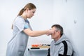 Male patient undergoes an eye test and prescription for eyeglasses in ophthalmology clinic. Optometrist checking patient Royalty Free Stock Photo