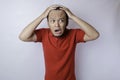 Male pattern hair loss problem concept. Young Asian man worried about balding. Baldness, alopecia in males Royalty Free Stock Photo