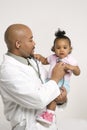 Male pediatrician examining baby girl. Royalty Free Stock Photo