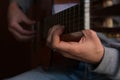 Male performer guitar player, hand focus