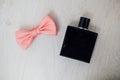 Male perfume and pink bow tie