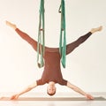 Male person do hammock yoga class exercise. Meditation in air calm