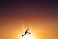 Male person leaps on the air at dusk time Royalty Free Stock Photo