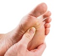 Male person receiving podiatry Royalty Free Stock Photo