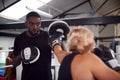 Male Personal Trainer Sparring With Female Boxer In Gym Using Training Gloves Royalty Free Stock Photo