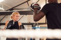 Male Personal Trainer Sparring With Female Boxer In Gym Using Training Gloves Royalty Free Stock Photo