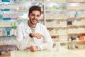 Male pharmacist dispensing medicine holding a box of tablets Royalty Free Stock Photo