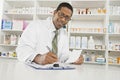 Male Pharmacist Working In Pharmacy Royalty Free Stock Photo