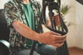 Male photographer with beard setting his camera equipment for shooting a video. Influencer setting up to make a online video.