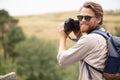 male photographer capturing rural landscape Royalty Free Stock Photo
